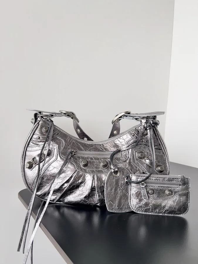 Balenciaga Le Cagole Bucket Bag with Classic Motorcycle Studs and Trendy Straps