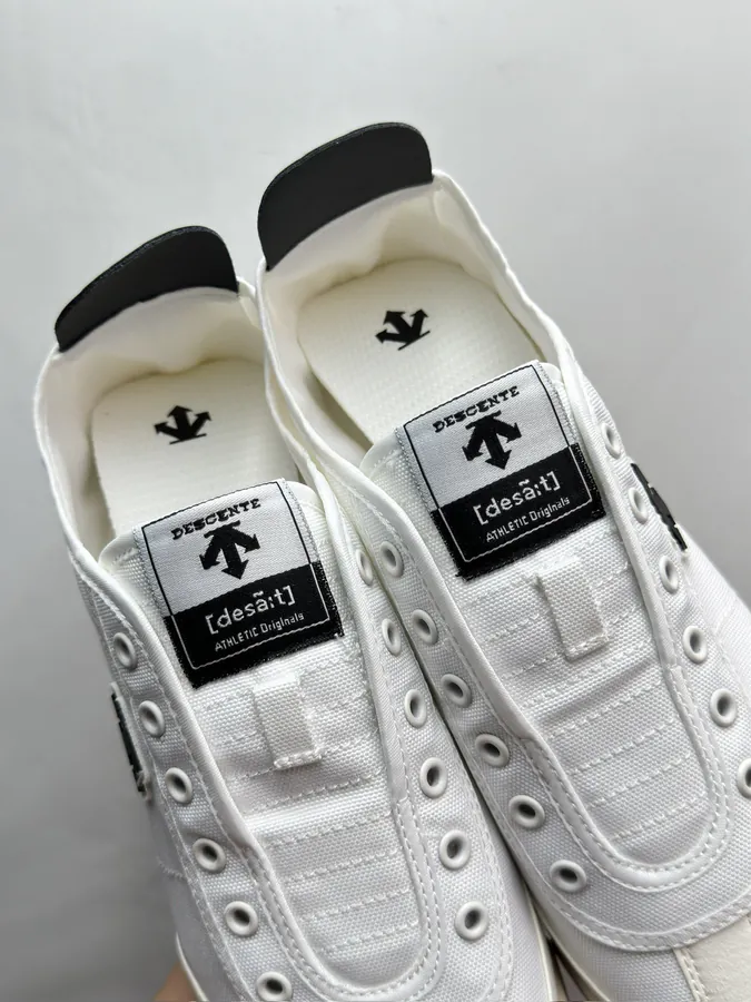 CON One Piece Slip On Sneaker in Black and White