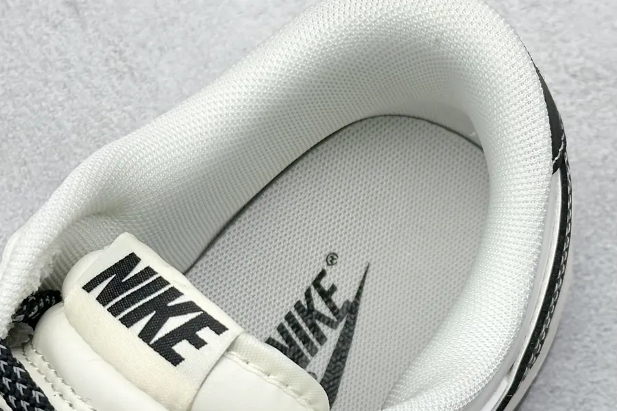 Nike SB Dunk Low in White and Black with Three Small Hooks