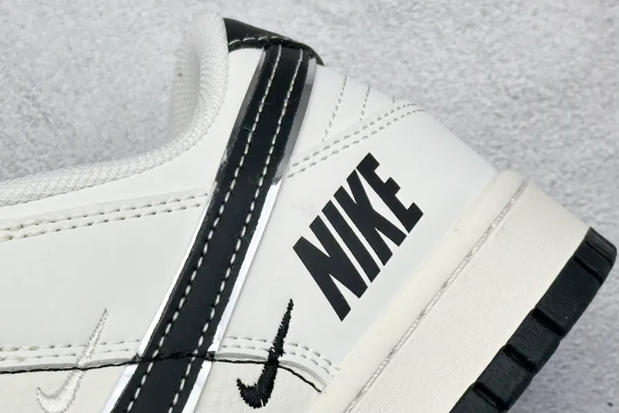 Nike SB Dunk Low in White and Black with Three Small Hooks