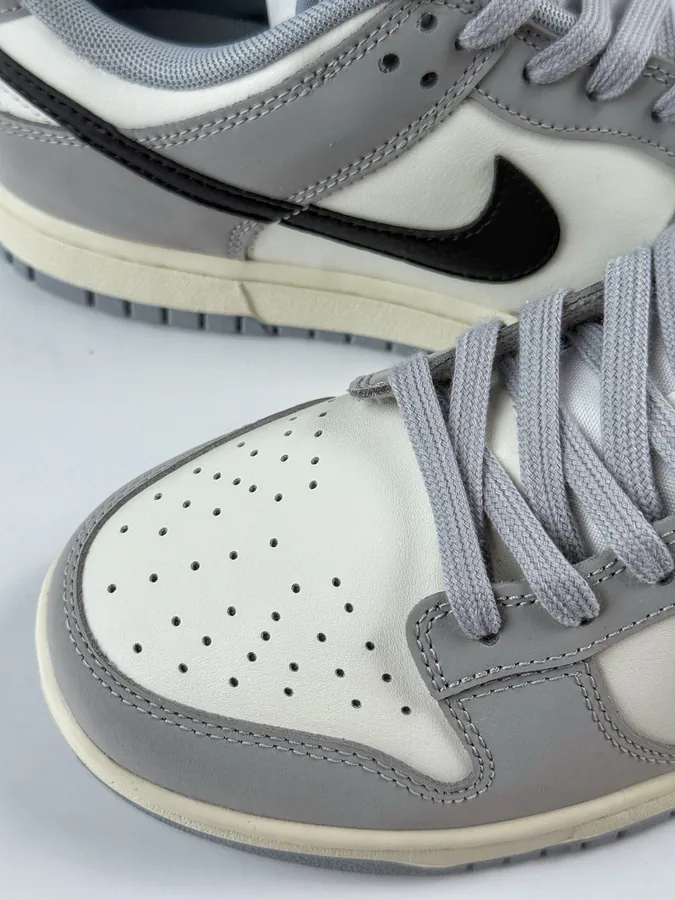 Nike Dunk Low in Gray, White, and Black